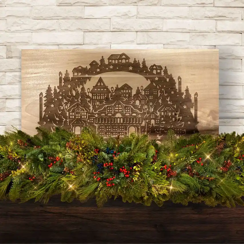 Laser engraved Christmas scene on a piece of maple wood.