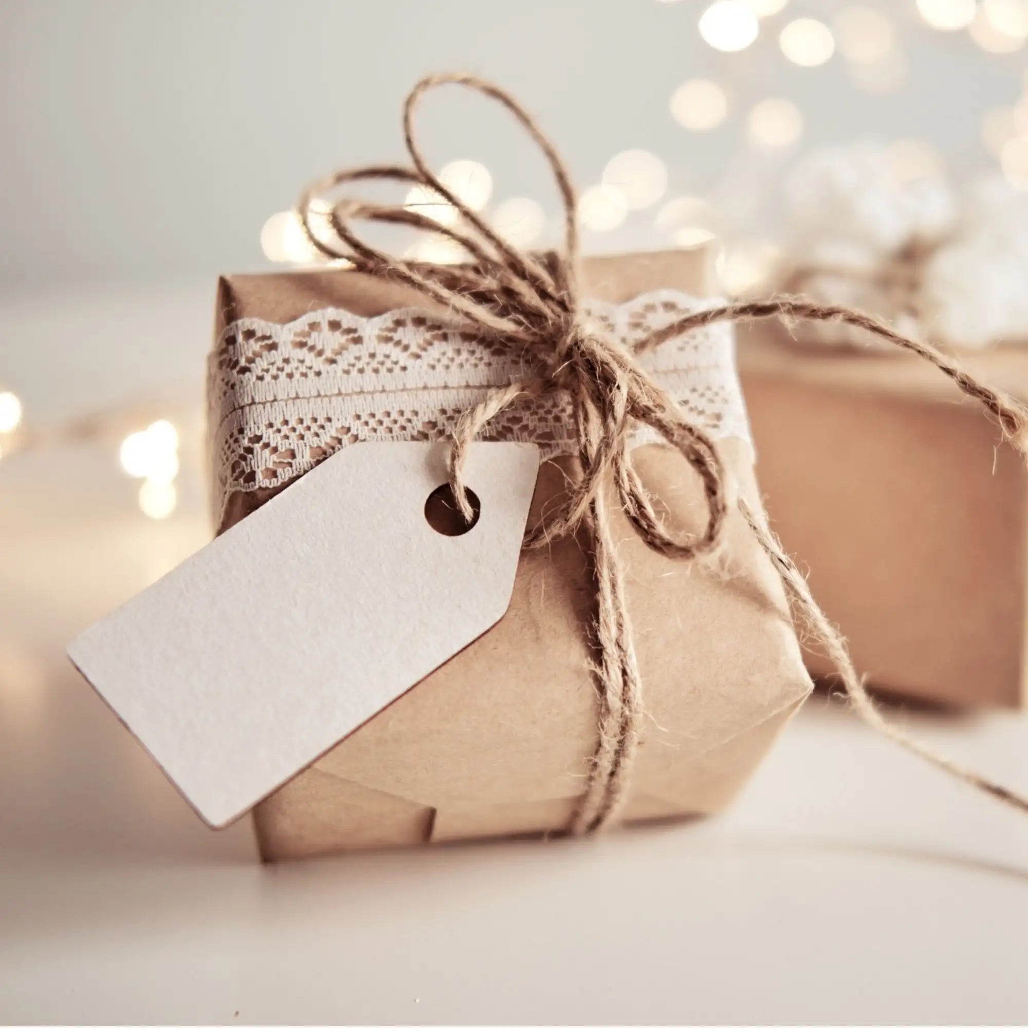 present wrapped with twine on a cream table