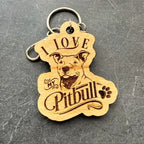 Wooden keychain with 'I love my Pitbull' text and pitbull dog illustration on a gray background