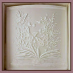 box with plastic panel embossed with open book with butterflies and flowers