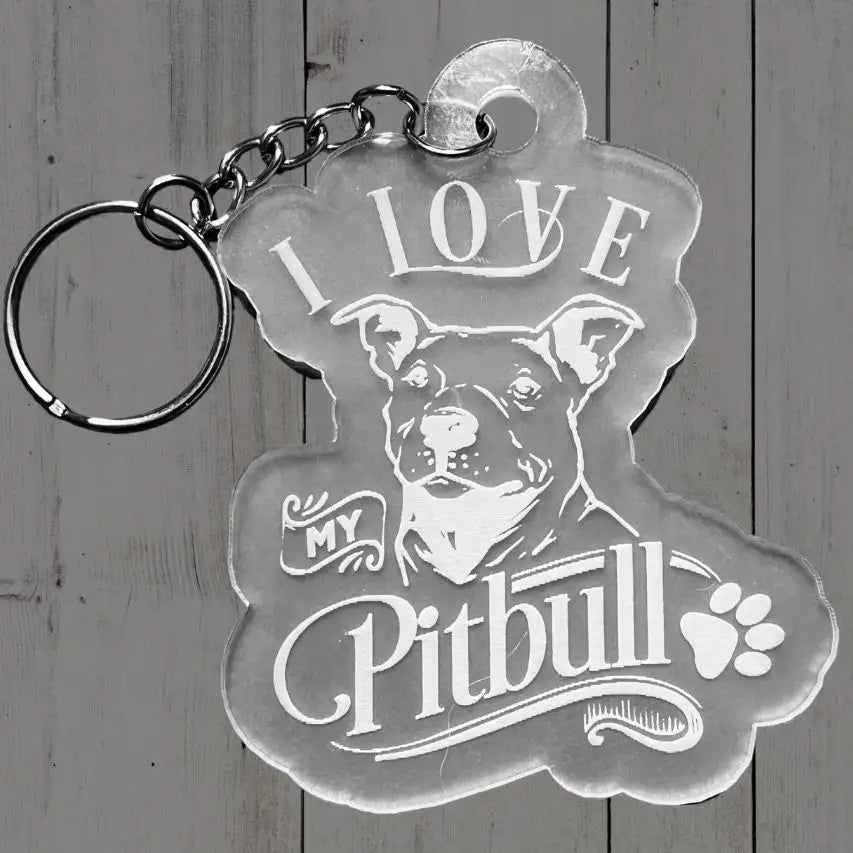 Acrylic keychain with 'I love my Pitbull' text and dog illustration on a wooden background