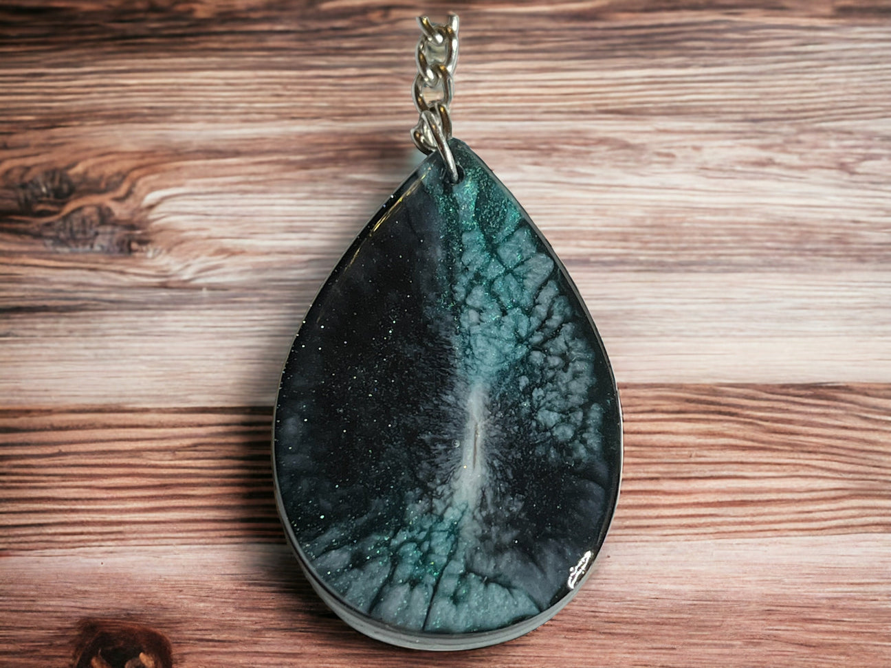Green teardrop shaped keychain