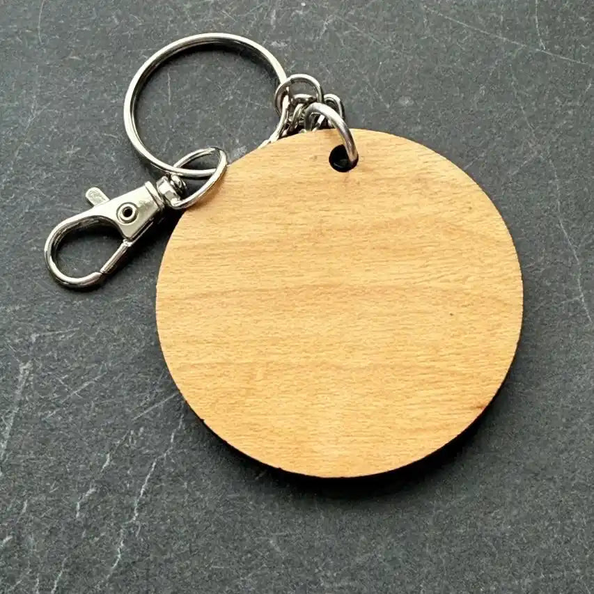 back of keychain with lobster clasp on dark grey background