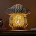 Mushroom-shaped lamp with fairy scene  on a wooden surface.