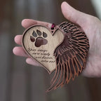 Paw heart memorial ornament held in a hand