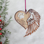 paw heart memorial ornament on white background with pine branches